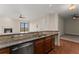Granite kitchen island with a double sink and a dishwasher at 351 Washington Ne Ave # 302, Marietta, GA 30060