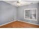 Simple bedroom with hardwood floors and a window at 3709 Tate Pl, Austell, GA 30106