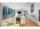 Modern kitchen with white cabinetry, marble countertops, and island at 40 12Th Ne St # 1202, Atlanta, GA 30309