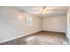 Bright bedroom featuring wood-look flooring and ceiling fan at 8309 Dunellen Ln, Jonesboro, GA 30238