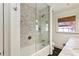 Bathroom with glass shower, marble tile, and built in tub at 3188 Verdun Nw Dr, Atlanta, GA 30305