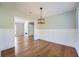 Bright dining room with hardwood floors and wainscoting at 4959 Hampstead Ln, Acworth, GA 30101