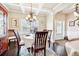 Bright dining room with hardwood floors and chandelier at 2103 Farmdale Ct, Conyers, GA 30047