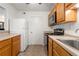 Kitchen with light wood cabinets, stainless steel appliances and tile floor at 1362 Branch Dr, Tucker, GA 30084