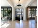 Bright foyer with black steel door, light wood floors and large windows at 3205 Verdun Nw Dr, Atlanta, GA 30305