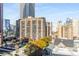 Building exterior and surrounding cityscape view at 565 Peachtree Ne St # 1209, Atlanta, GA 30308