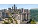 Aerial city view, showcasing a modern high-rise building with a rooftop pool at 565 Peachtree Ne St # 1209, Atlanta, GA 30308