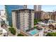 High-rise building with rooftop pool; city views at 565 Peachtree Ne St # 1209, Atlanta, GA 30308