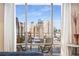 Private balcony with city views and seating for two at 565 Peachtree Ne St # 1209, Atlanta, GA 30308