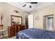 Bright bedroom with dresser, mirror, and comfortable bedding at 565 Peachtree Ne St # 1209, Atlanta, GA 30308