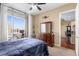 Bedroom with city views and access to a balcony at 565 Peachtree Ne St # 1209, Atlanta, GA 30308