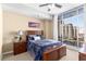 Bright bedroom with city views and a ceiling fan at 565 Peachtree Ne St # 1209, Atlanta, GA 30308