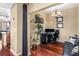 Home office features hardwood floors, a comfortable couch, and built-in workspace at 565 Peachtree Ne St # 1209, Atlanta, GA 30308