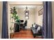 Home office features hardwood floors, a comfortable couch, and built-in workspace at 565 Peachtree Ne St # 1209, Atlanta, GA 30308