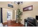 Home office features hardwood floors, a comfortable couch, and built-in workspace at 565 Peachtree Ne St # 1209, Atlanta, GA 30308