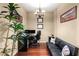 Home office features hardwood floors, a comfortable couch, and built-in workspace at 565 Peachtree Ne St # 1209, Atlanta, GA 30308