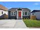 Recently renovated home featuring gray siding, a new driveway, and well-manicured lawn at 541 Sunset Nw Ave, Atlanta, GA 30318