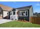 Newly remodeled home with gray siding, a wooden fence, and a neat front yard at 541 Sunset Nw Ave, Atlanta, GA 30318