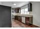 Updated kitchen featuring dark cabinets, granite countertops, and stainless steel appliances at 541 Sunset Nw Ave, Atlanta, GA 30318