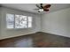 Living room with hardwood floors, large window, and ceiling fan at 541 Sunset Nw Ave, Atlanta, GA 30318