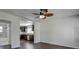 Open concept living room with dark hardwood floors and a view into the kitchen at 541 Sunset Nw Ave, Atlanta, GA 30318