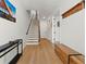 Light-filled entryway with hardwood floors, bench, and staircase at 106 Wilburn Ln, Decatur, GA 30030