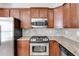 Kitchen features stainless steel appliances and granite countertops at 2529 Friar Tuck Se Ln, Atlanta, GA 30339