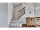 Elegant staircase with a wooden handrail and carpeted steps at 2529 Friar Tuck Se Ln, Atlanta, GA 30339