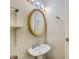 Simple bathroom with pedestal sink and oval mirror at 5267 Tasman Trl, Lithonia, GA 30038
