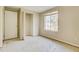 Simple bedroom with closet and window, awaiting new flooring at 5267 Tasman Trl, Lithonia, GA 30038