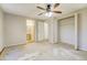Spacious bedroom with ceiling fan and large closet at 5267 Tasman Trl, Lithonia, GA 30038