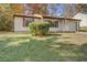 House exterior showcasing a well-maintained lawn at 5267 Tasman Trl, Lithonia, GA 30038