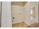 Laundry closet with shelving and hookups for washer/dryer at 5267 Tasman Trl, Lithonia, GA 30038