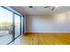 Spacious living room featuring hardwood floors and access to a private balcony at 300 Johnson Ferry Ne Rd # B611, Atlanta, GA 30328