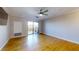 Spacious living room featuring hardwood floors and sliding glass door to balcony at 300 Johnson Ferry Ne Rd # B611, Atlanta, GA 30328