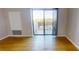 Bright living room with hardwood floors and sliding glass doors leading to a balcony at 300 Johnson Ferry Ne Rd # B611, Atlanta, GA 30328