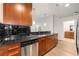 Modern kitchen with stainless steel appliances and dark countertops at 3324 Peachtree Ne Rd # 1005, Atlanta, GA 30326