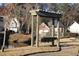 Wooden pergola with swing bench overlooking a pond at 1920 Rosebriar Dr, Marietta, GA 30066