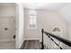 Upstairs hallway with laundry closet and arched windows at 1920 Rosebriar Dr, Marietta, GA 30066