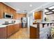 Modern kitchen featuring stainless steel appliances and wood cabinetry at 2984 Winterthur Close Nw, Kennesaw, GA 30144