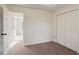 Bedroom with neutral walls, carpet, and double door closet at 4524 Glider Cir, Douglasville, GA 30135