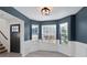 Bright dining room with bay window, dark door, and white wainscoting at 4524 Glider Cir, Douglasville, GA 30135