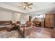 Spacious living room with hardwood floors, fireplace and large windows at 240 Thistlewood Ln, Roswell, GA 30075