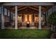 Evening view of covered patio with fire pit and seating at 4427 Cheston Ne Bnd, Roswell, GA 30075