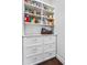 Well-organized pantry with ample shelving and drawers for storage at 4427 Cheston Ne Bnd, Roswell, GA 30075