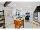 Modern kitchen with white cabinets and island at 4760 Hillside Dr, Acworth, GA 30101