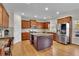 Modern kitchen with granite countertops and stainless steel appliances at 3670 Falling Leaf Ln, Cumming, GA 30041