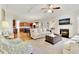 Spacious living room featuring a fireplace and an open floor plan at 3670 Falling Leaf Ln, Cumming, GA 30041