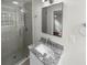 Updated bathroom with granite vanity, subway tile shower, and modern fixtures at 2320 Capehart Ne Cir, Atlanta, GA 30345