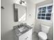 Clean bathroom, granite countertop, and updated fixtures at 2320 Capehart Ne Cir, Atlanta, GA 30345